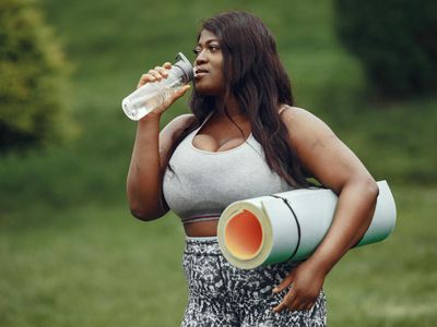 Beginner doing gentle cardio exercises at home